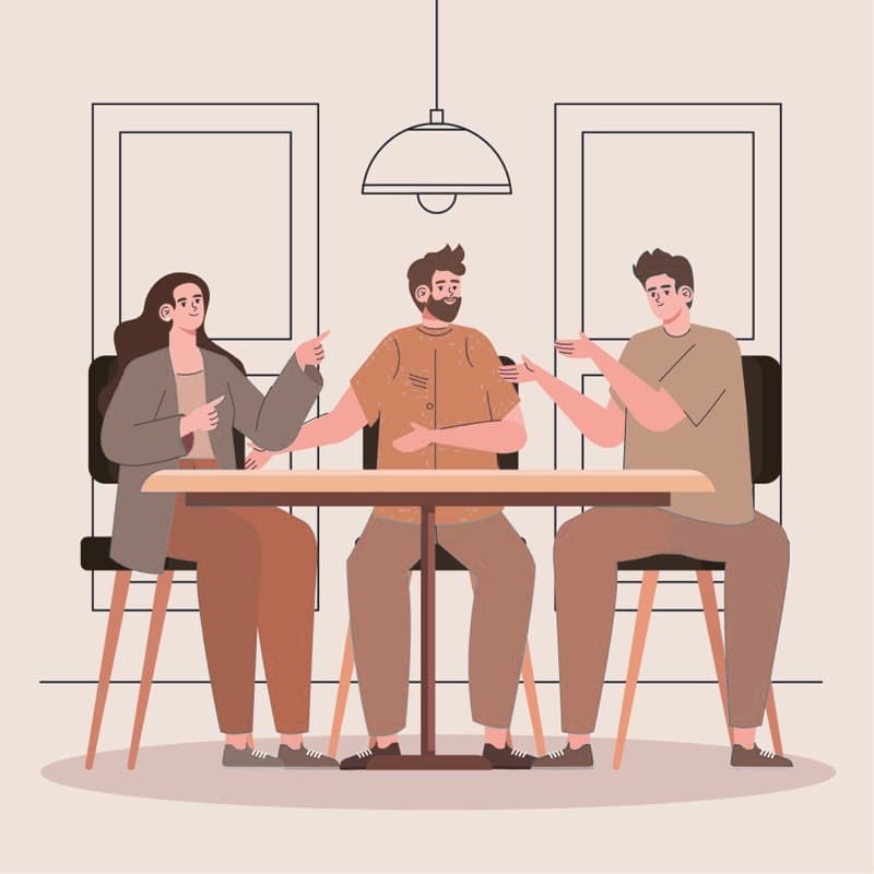 Two people in a studio having a first conversation about a home brief.